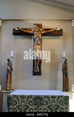 Crucifix and candle holders by Peter Eugene Ball in St. Philip`s Cathedral, Birmingham, UK Stock Photo